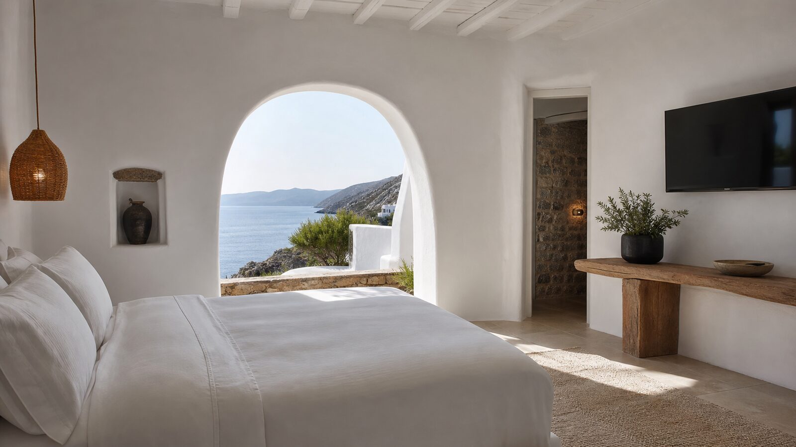Sea Glass Room with linen bed and water view